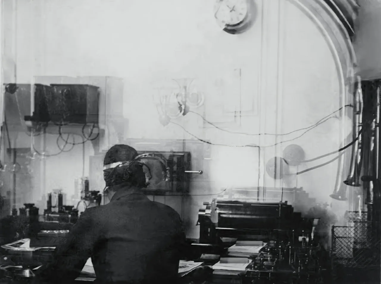 The only picture of the Marconi radio room onboard the Titanic. Harold Bride is seated at the desk.